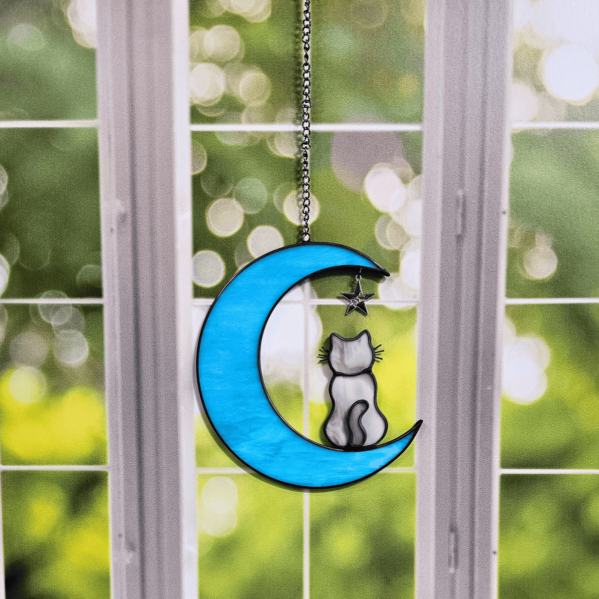 Cat on Moon with Starts Memorial Suncatcher for Pet Loss hanging in a window.