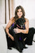 Co-founder Remy Bibaud of Pet Perennials with her black Labrador Retriever named Harley